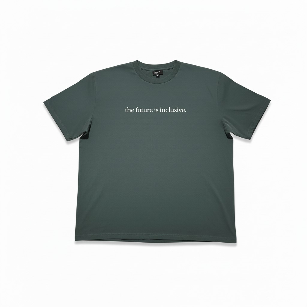 Green crewneck t-shirt with 'the future is inclusive' text on a white background